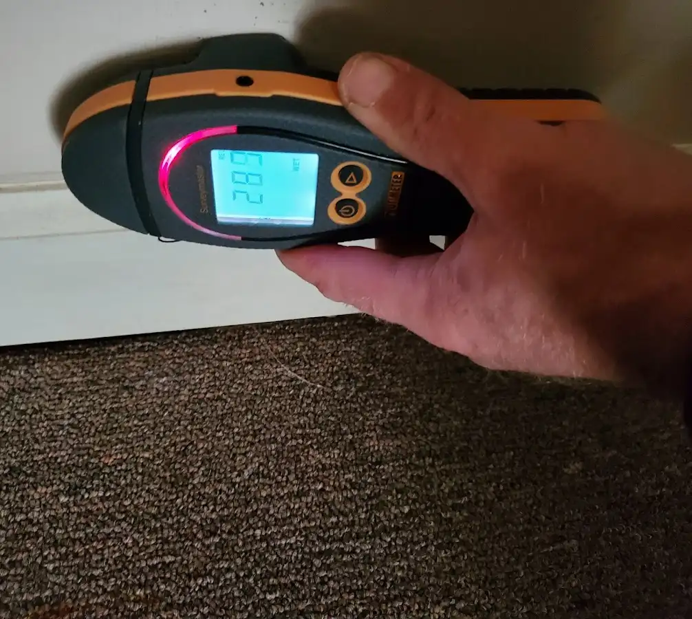 Moisture detection at baseboard during Storm Damage Restoration in North Mankato